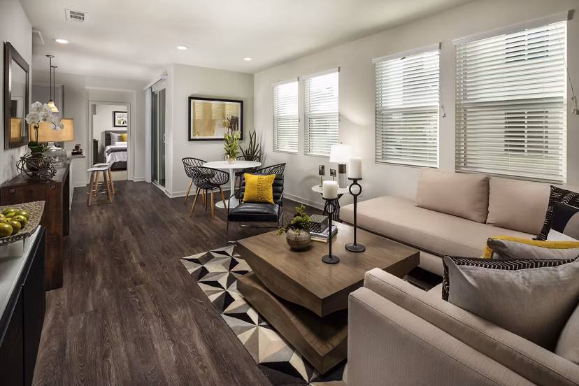 Spacious living room with elegant furnishings at Terrano Apartments, featuring modern design elements