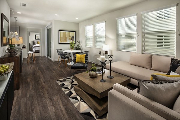 Spacious living room with elegant furnishings at Terrano Apartments, featuring modern design elements