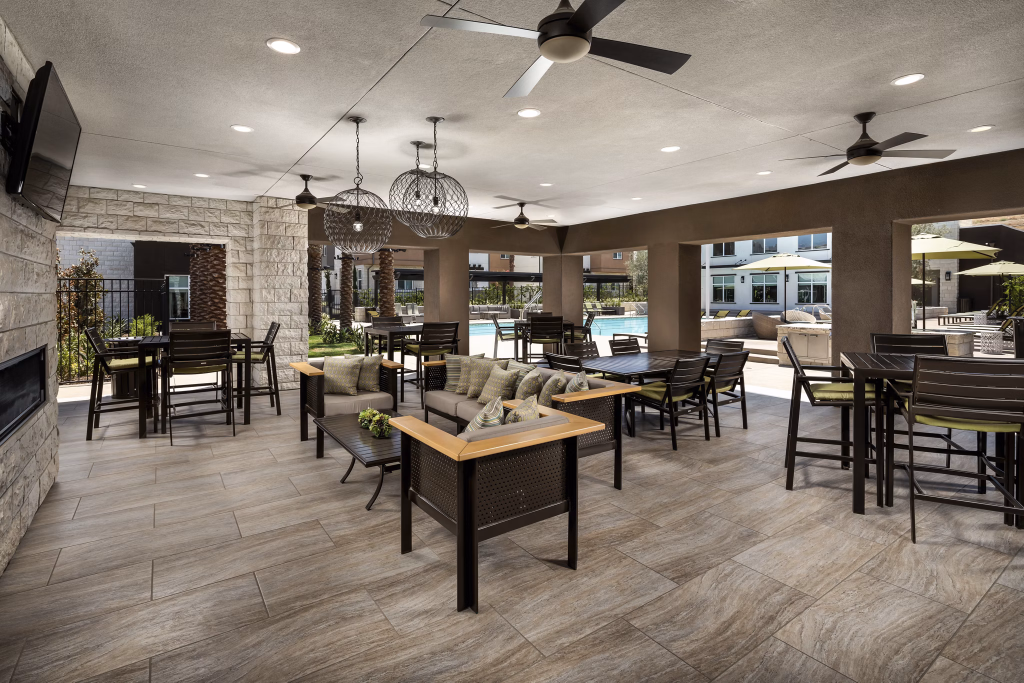 Outdoor patio with cozy seating at Terrano Apartments