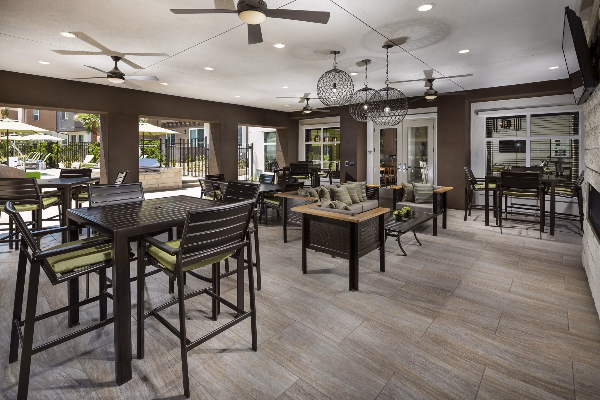 Outdoor patio room with modern seating at Terrano Apartments