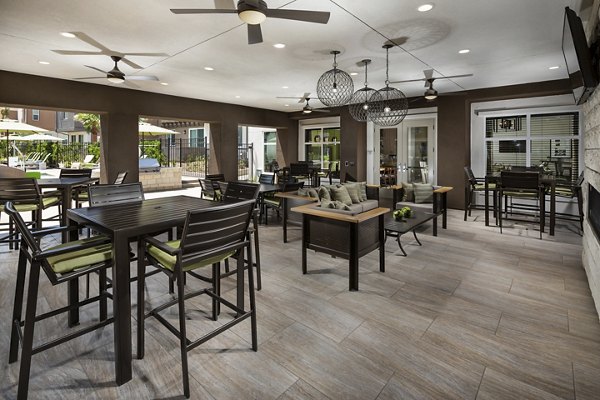 Outdoor patio room with modern seating at Terrano Apartments