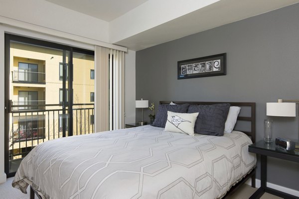 Cozy bedroom with modern decor at Crescent Village Apartments