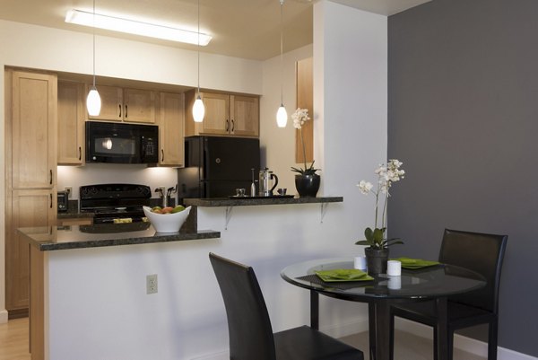 Dining area with modern furnishings at Crescent Village Apartments