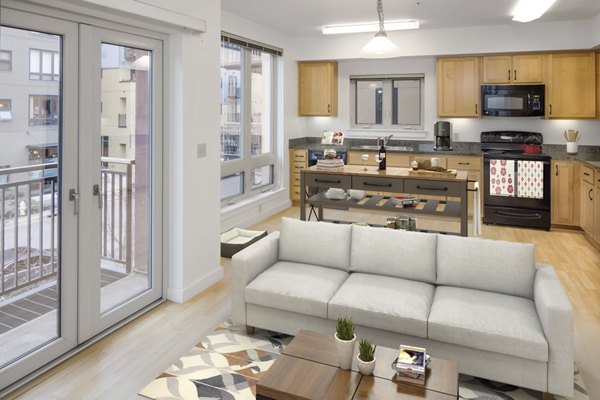 Open-concept kitchen with modern appliances and sleek counters in Crescent Village Apartments