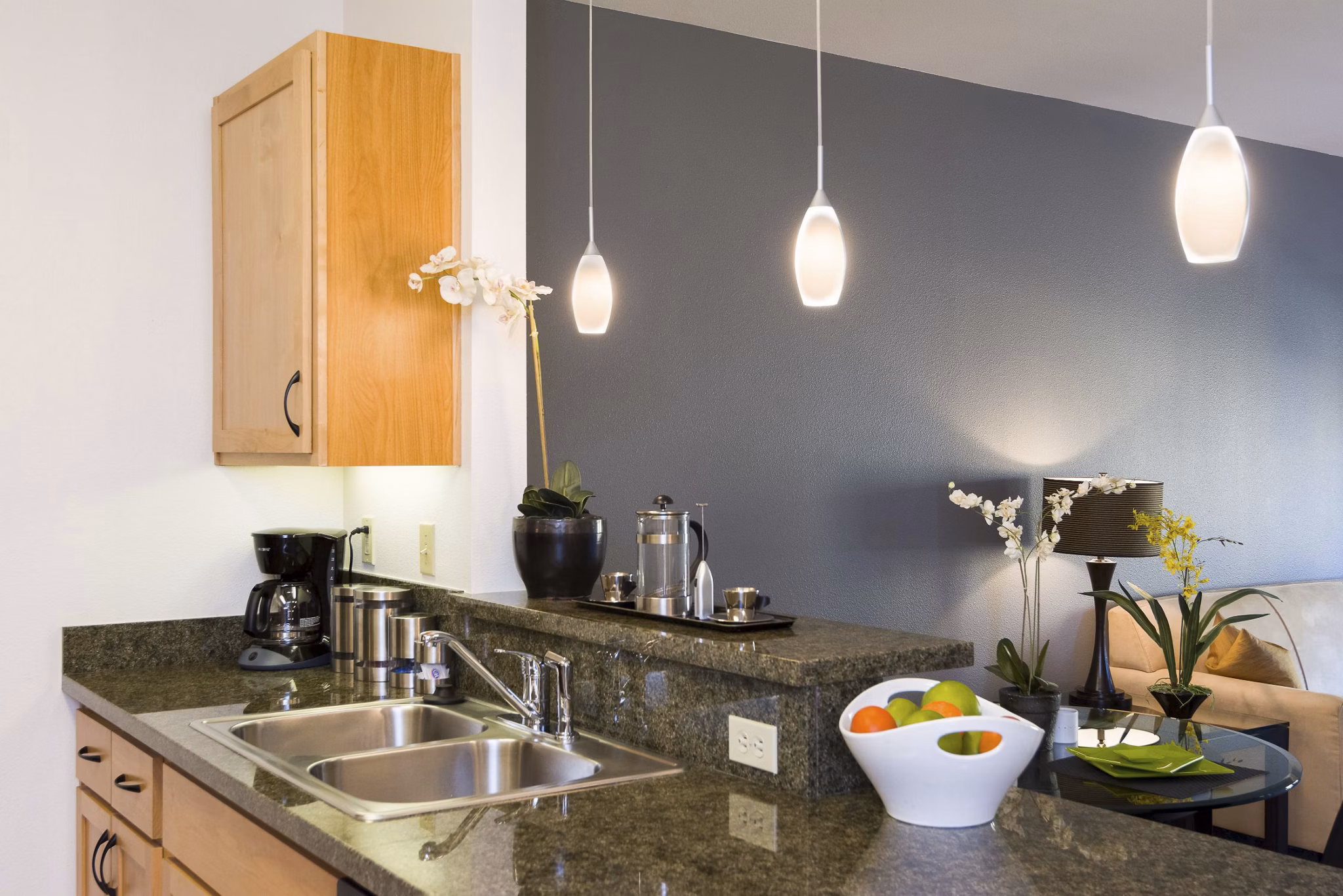 Modern kitchen with stainless steel appliances at Crescent Village Apartments, ideal for luxury living