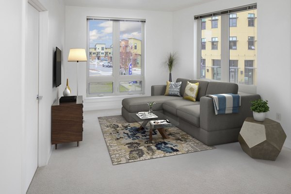 Spacious living room with modern furnishings in Crescent Village Apartments