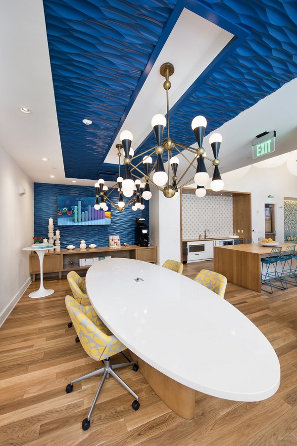 Anchor Riverwalk Apartments: Modern clubhouse featuring lounging areas and meeting spaces, ideal for socializing and events