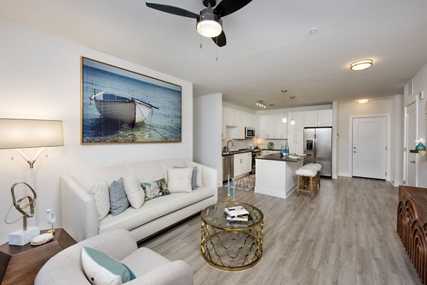 Spacious living area with modern decor in Anchor Riverwalk Apartments, luxurious atmosphere in a Greystar community setting