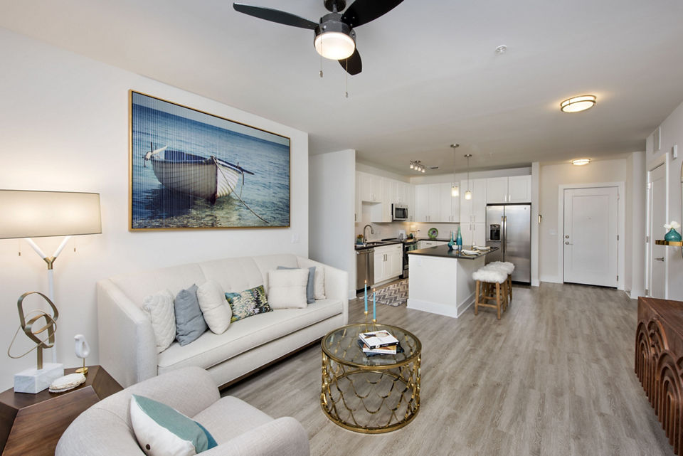 Spacious living area with modern decor in Anchor Riverwalk Apartments, luxurious atmosphere in a Greystar community setting