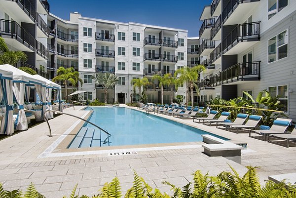 Luxurious infinity pool at Anchor Riverwalk Apartments with modern surroundings and poolside seating