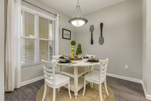 Modern dining area with elegant lighting at The Arboretum Apartments offering luxury living spaces for residents