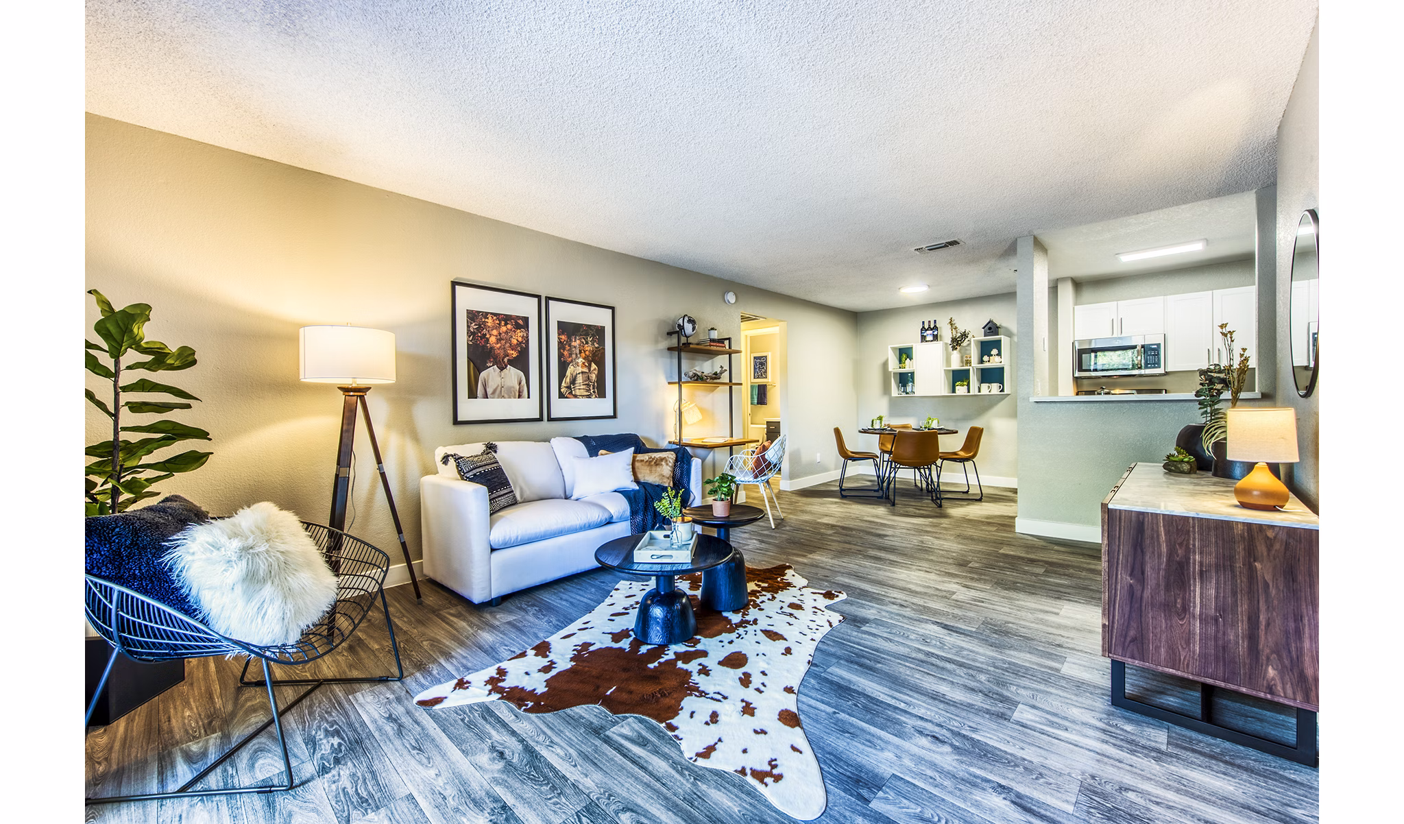 Spacious living room with modern furnishings at CIRC Apartments, showcasing luxury interiors for comfortable urban living