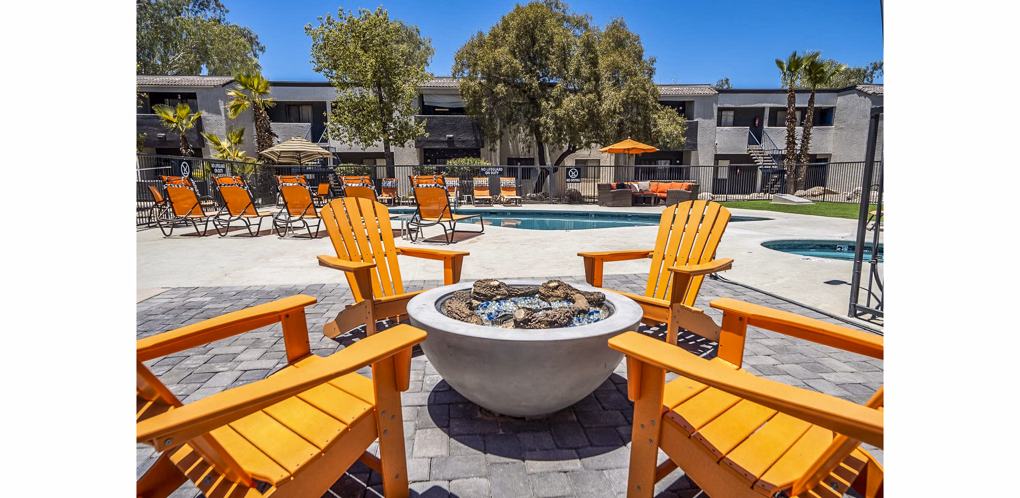 Patio with modern seating and lush greenery at CIRC Apartments