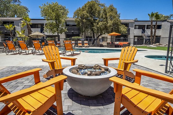 Patio with modern seating and lush greenery at CIRC Apartments