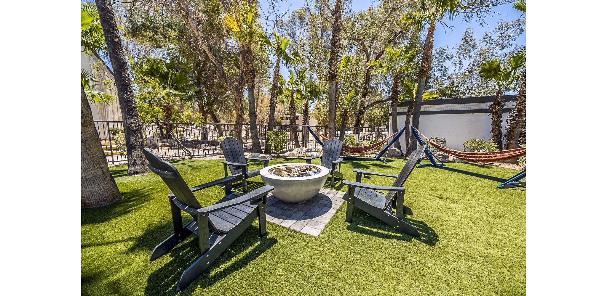 CIRC Apartments: Stylish patio with modern furniture and greenery offers outdoor relaxation in a luxurious setting