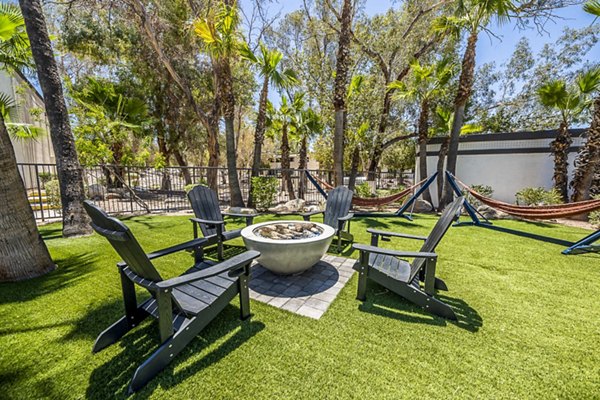CIRC Apartments: Stylish patio with modern furniture and greenery offers outdoor relaxation in a luxurious setting