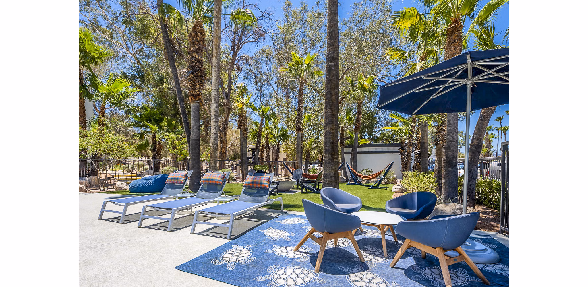 CIRC Apartments: Stylish patio with cozy seating and greenery, perfect for relaxation