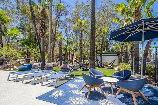 CIRC Apartments: Stylish patio with cozy seating and greenery, perfect for relaxation