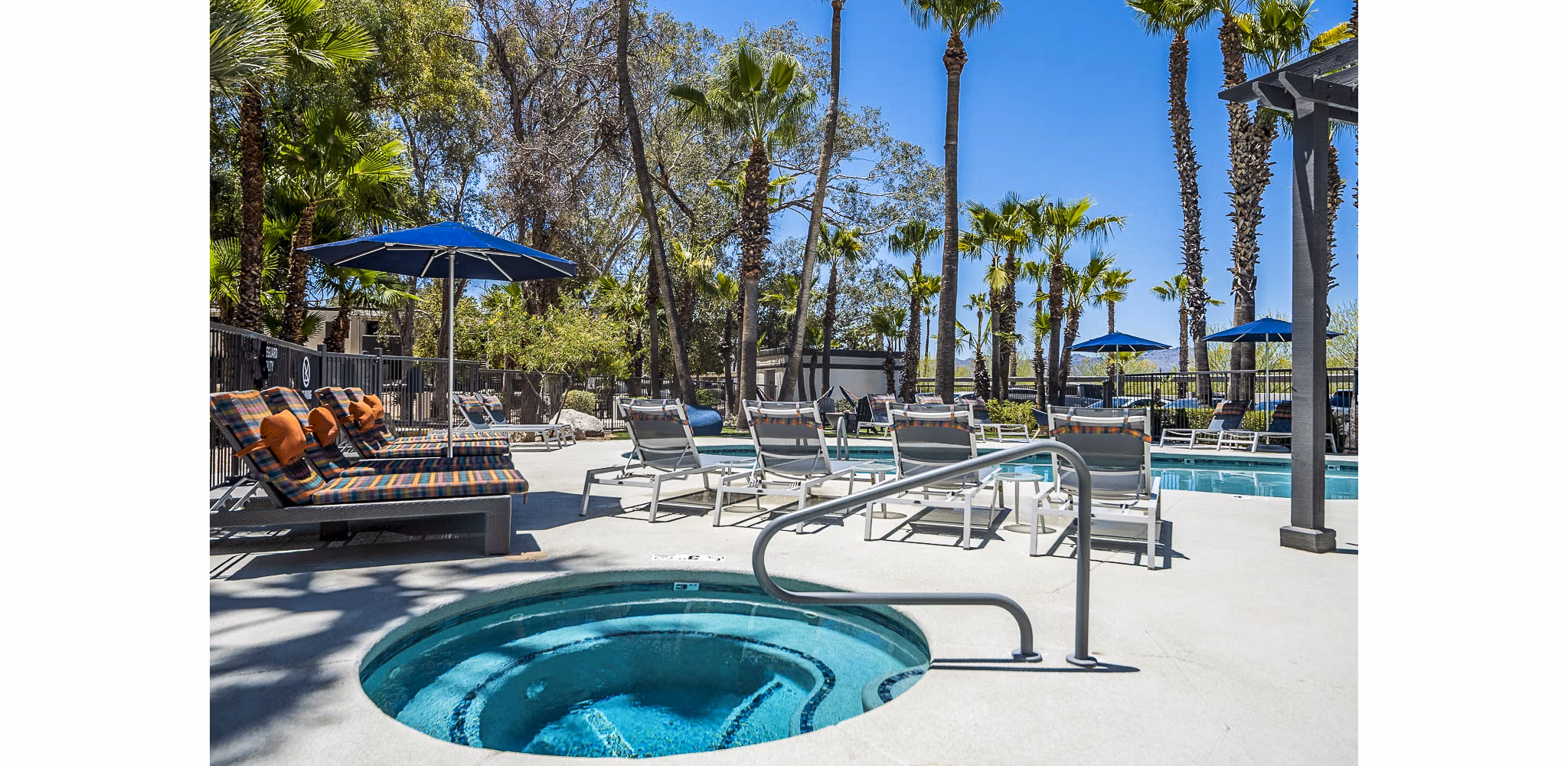 Luxurious pool area with modern seating at CIRC Apartments, perfect for relaxation and leisure activities