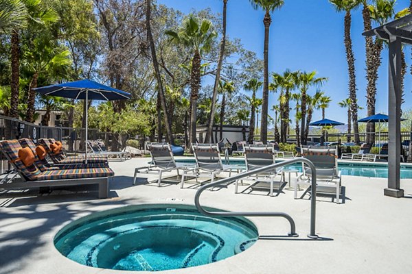 Luxurious pool area with modern seating at CIRC Apartments, perfect for relaxation and leisure activities