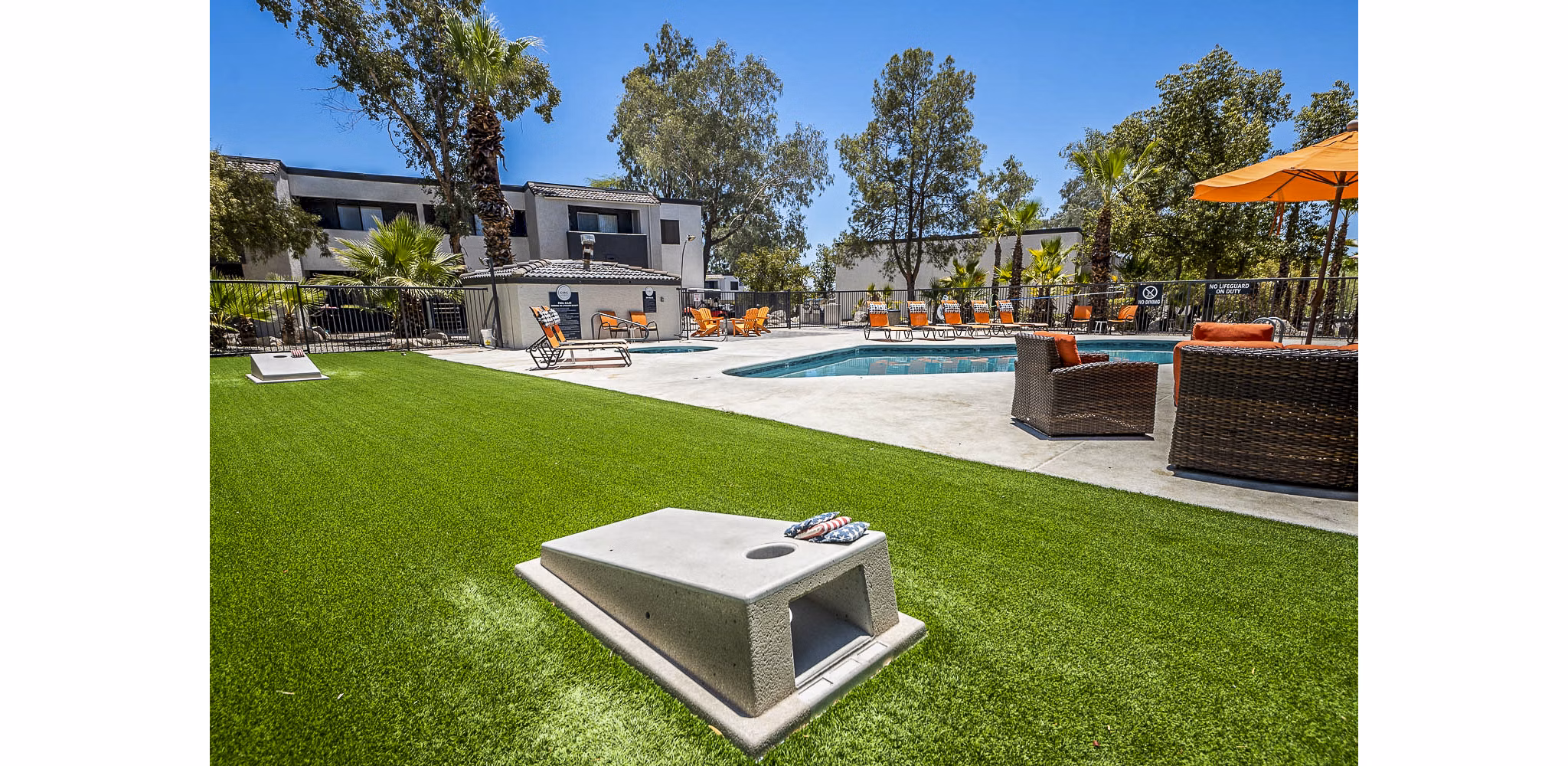 Outdoor grill area with modern seating at CIRC Apartments
