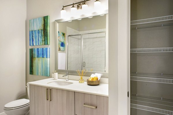 Modern bathroom with sleek fixtures at 555 Ross Apartments