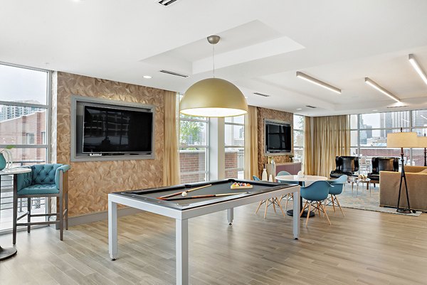 Elegant clubhouse featuring modern decor at 555 Ross Apartments, Dallas