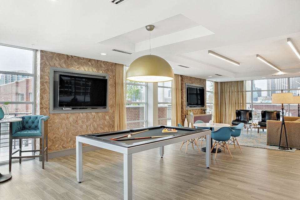 Elegant clubhouse featuring modern decor at 555 Ross Apartments, Dallas