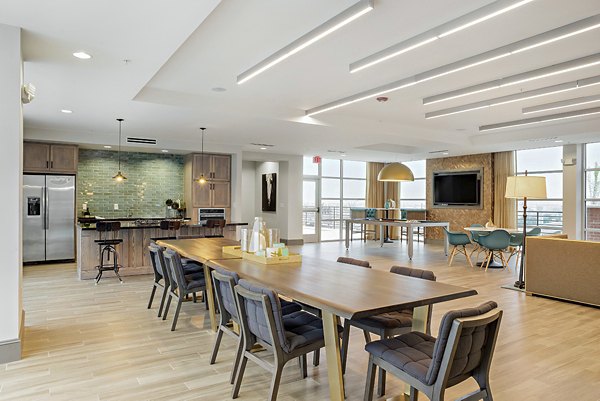 Modern clubhouse with lounge seating at 555 Ross Apartments, Dallas