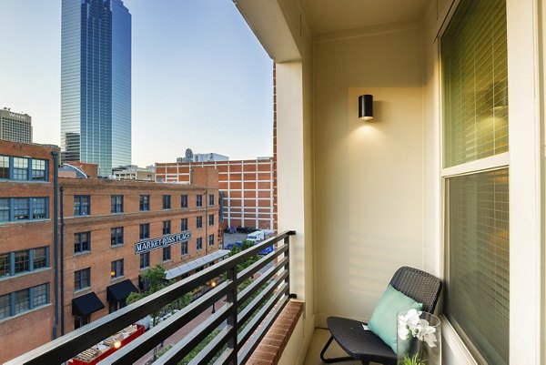 Private balcony offering stunning city views at 555 Ross Apartments, luxury living in the heart of the city