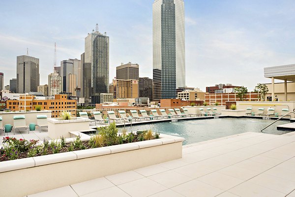 Rooftop pool with skyline views at 555 Ross Apartments