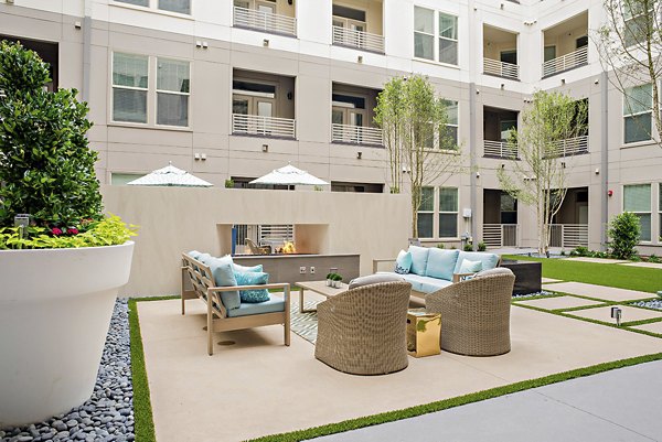 Relaxing recreational area at 555 Ross Apartments featuring seating areas and open spaces for socializing