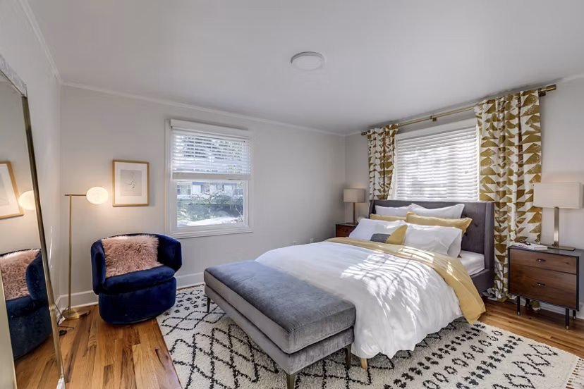 Spacious bedroom with modern furnishings at Shorewood luxury apartments