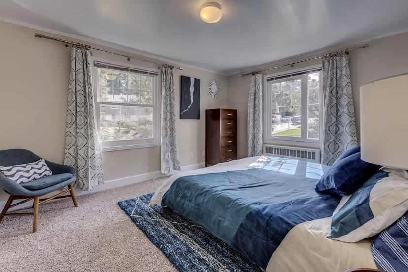 Elegant bedroom with coastal decor at Shorewood luxury apartments