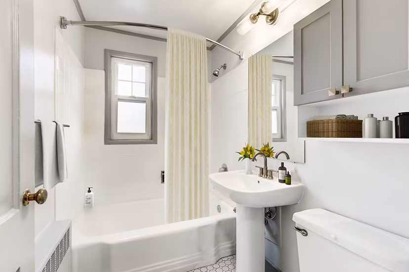 Modern bathroom with marble countertops and sleek fixtures in Shorewood Apartments