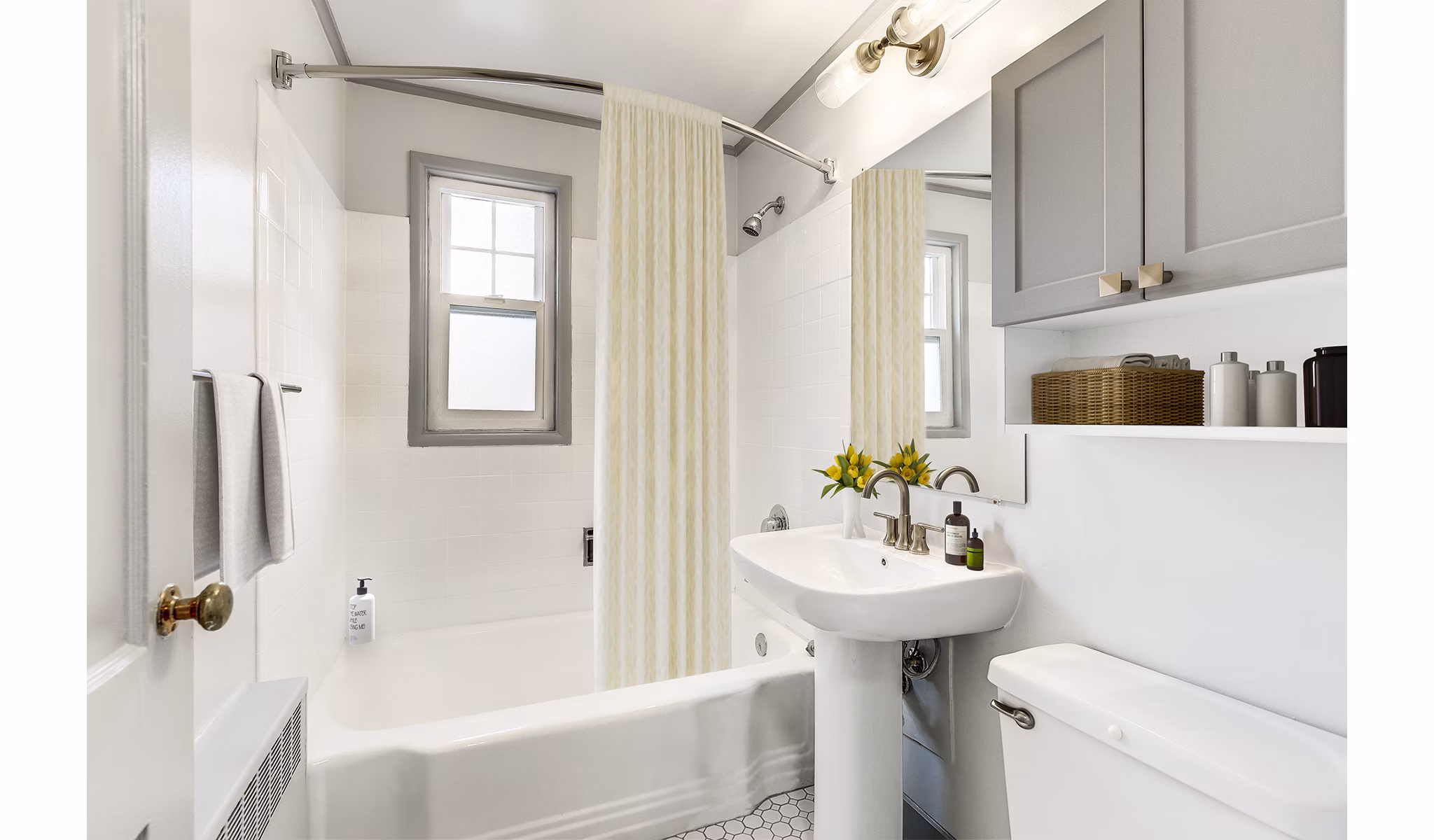 Modern bathroom with marble countertops and sleek fixtures in Shorewood Apartments