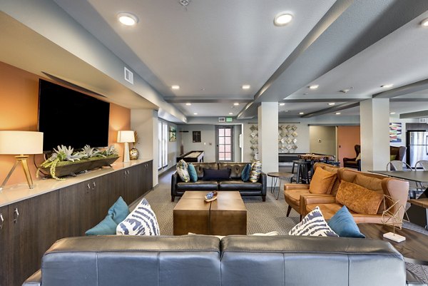 Clubhouse with modern design elements at Shorewood Heights Apartments, featuring spacious seating areas and natural light