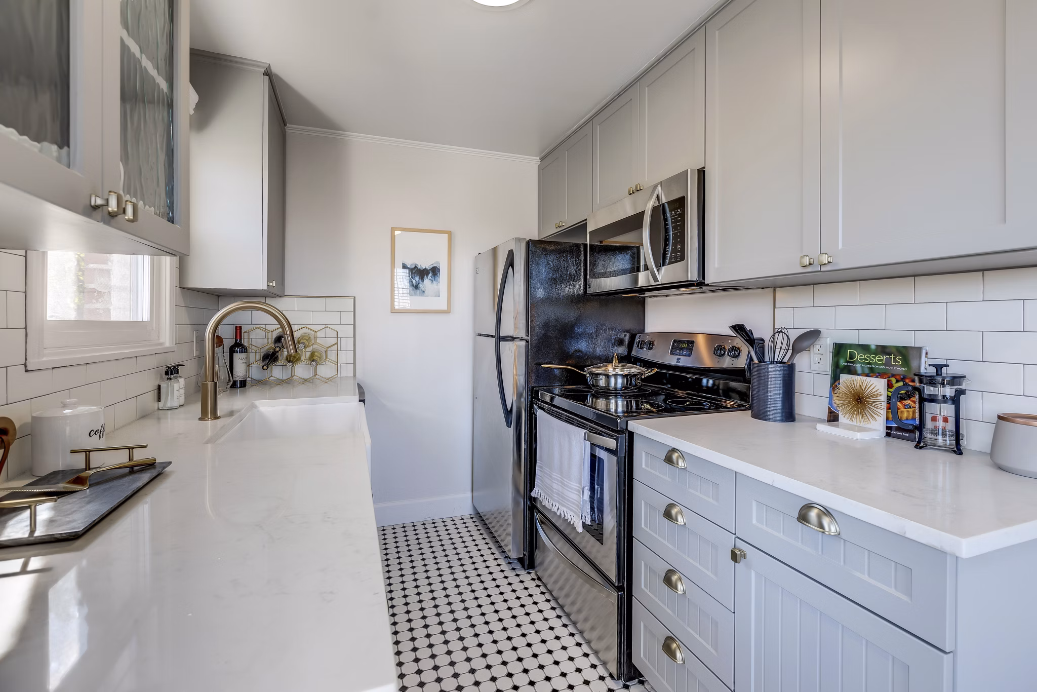 Modern kitchen with stainless steel appliances in Shorewood luxury apartments