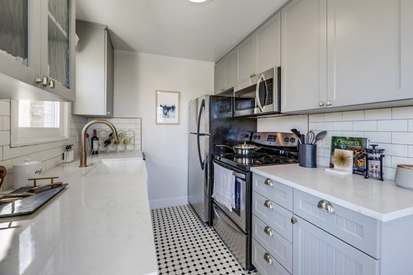 Modern kitchen with stainless steel appliances in Shorewood luxury apartments