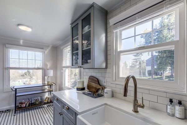 Modern kitchen with stainless steel appliances at Shorewood luxury apartments, featuring sleek countertops and ample storage