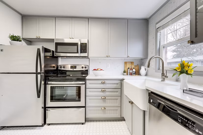 Modern kitchen featuring stainless steel appliances and sleek countertops in Shorewood Apartments