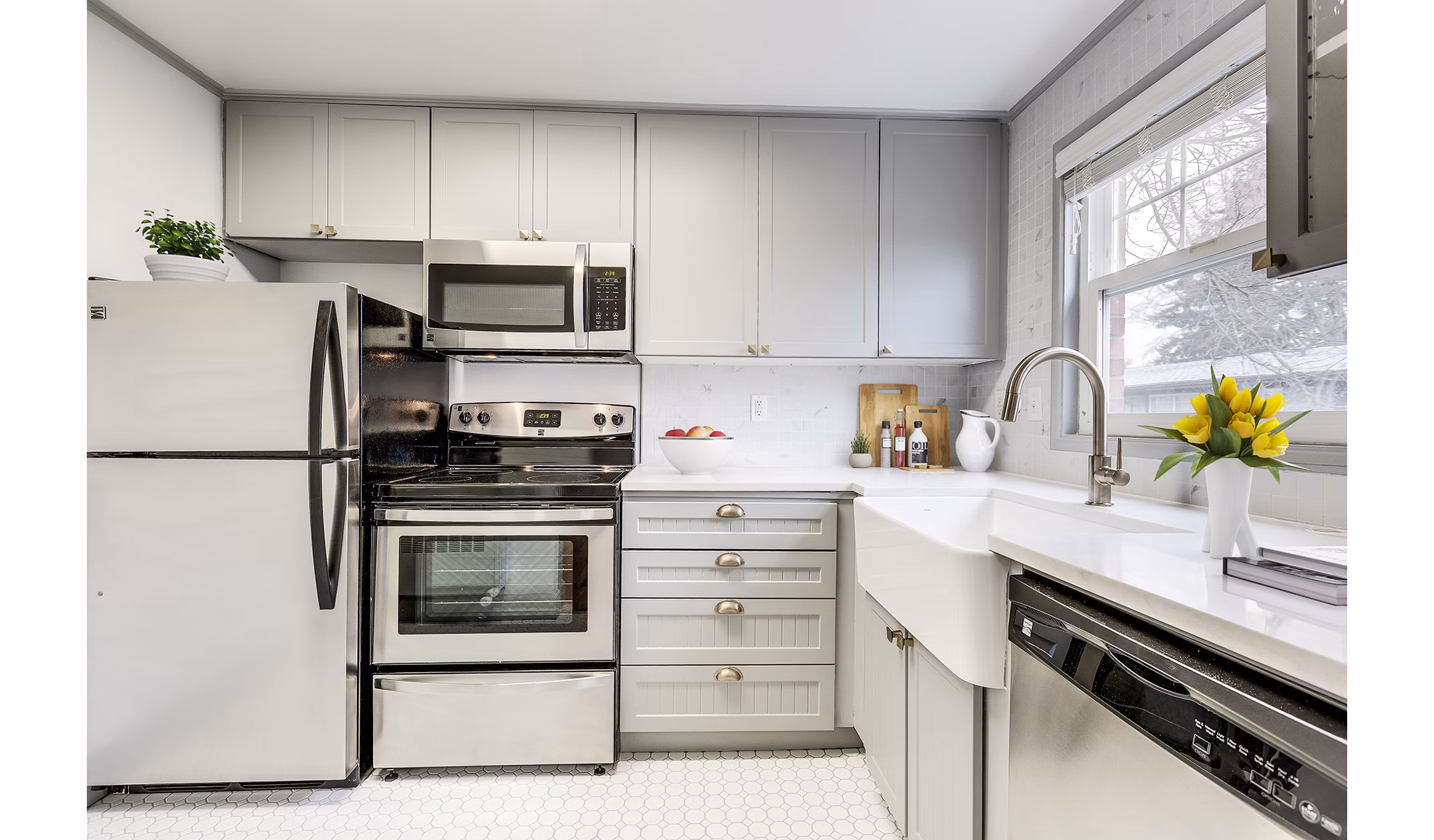 Modern kitchen featuring stainless steel appliances and sleek countertops in Shorewood Apartments