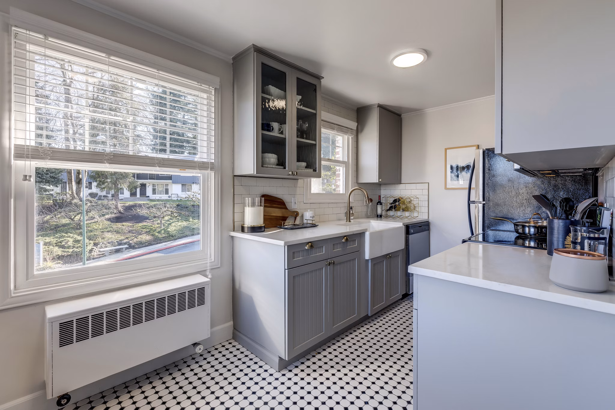 Modern kitchen with granite countertops and stainless-steel appliances in Shorewood luxury apartments