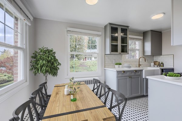 Modern kitchen with sleek cabinetry and stainless steel appliances at Shorewood Apartments