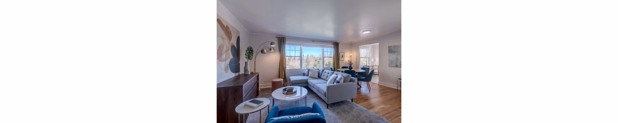 Spacious living room with contemporary furnishings at Shorewood luxury apartments