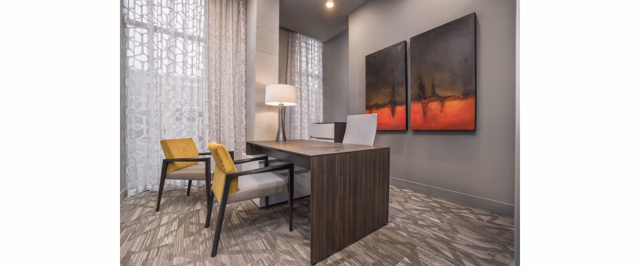 Clubhouse featuring modern design and ample seating at Main & Clay Apartments in Louisville