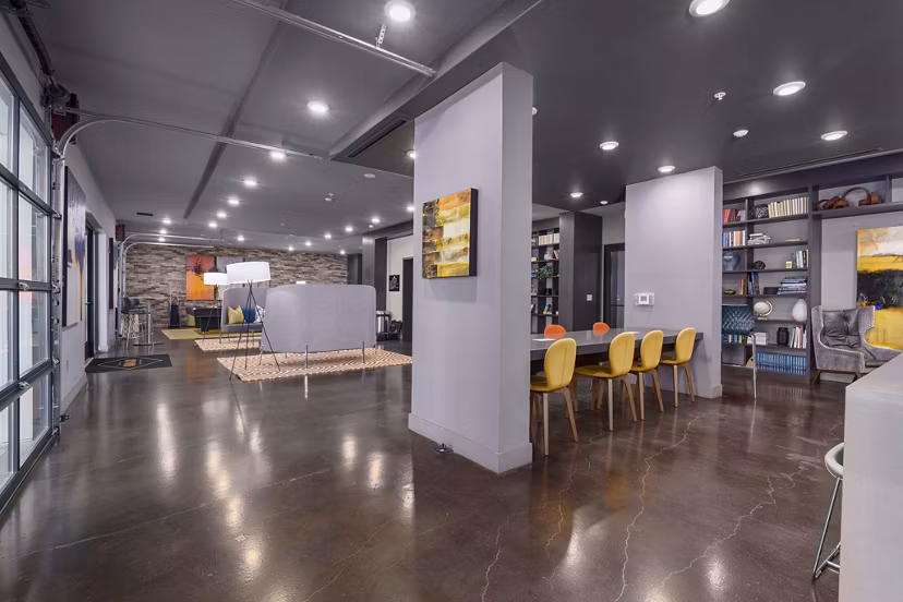 Clubhouse featuring modern design and seating areas at Main & Clay Apartments, a luxurious Greystar property in the heart of the city