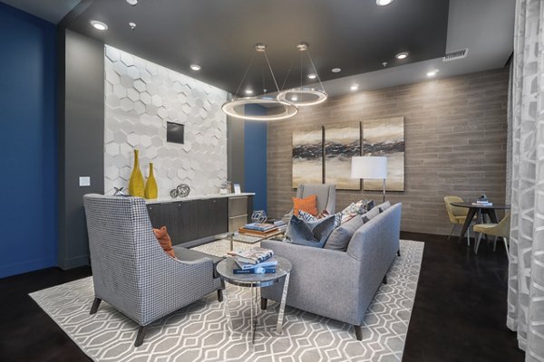 Clubhouse featuring modern design and seating areas at Main & Clay Apartments, a luxurious Greystar property in the heart of the city