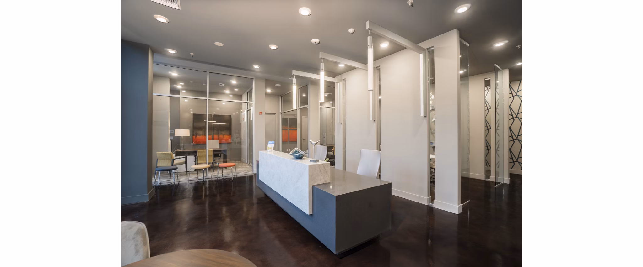 Clubhouse with modern furnishings and ample seating at Main & Clay Apartments offering luxury living in a vibrant community
