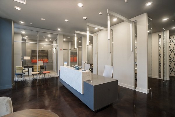 Clubhouse with modern furnishings and ample seating at Main & Clay Apartments offering luxury living in a vibrant community